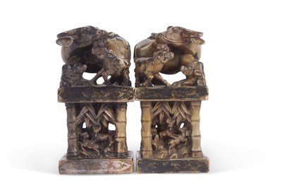 Lot 85 - A pair of soap stone figures modelled as...