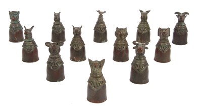 Lot 92 - An unusual set of Chinese metal stirrup cups,...