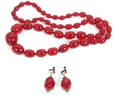 Lot 249 - A faux amber bead necklace, with oval beads...