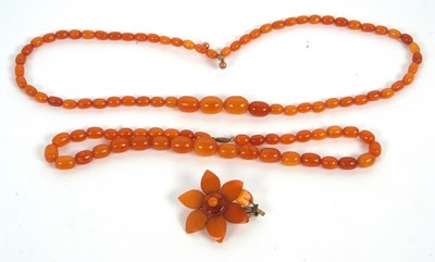 Lot 200 - Two butterscotch amber bead necklaces and a...