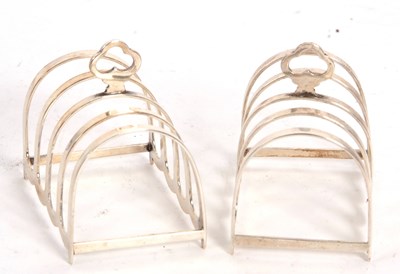 Lot 47 - A small pair of cased George V silver toast...