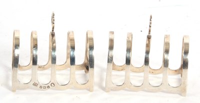 Lot 47 - A small pair of cased George V silver toast...