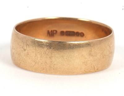 Lot 184 - A 9ct wedding band, 8mm wide, hallmarked...