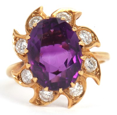 Lot 37 - An 18ct amethyst and diamond ring, the oval...