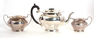 Lot 168 - A George V silver three piece tea set of oval...