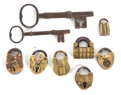 Lot 412 - A quantity of vintage brass and steel padlocks...