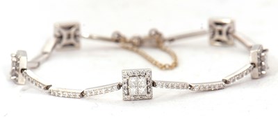 Lot 18 - A 14KT diamond bracelet, set throughout with...