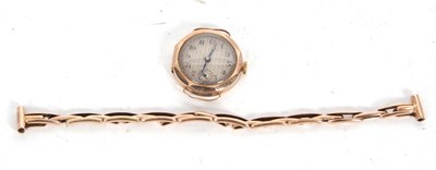 Lot 226 - A 9ct gold cased lady's watch on a yellow...