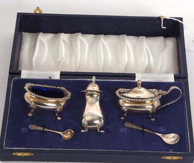 Lot 175 - A cased three piece silver cruet set...