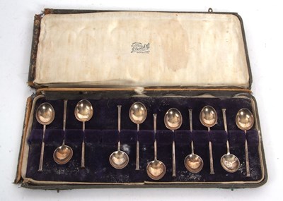 Lot 184 - A cased group of eleven seal top white metal...