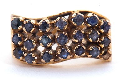 Lot 20 - An 18ct sapphire ring, set with three curved...