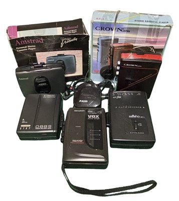 Lot 135 - Five vintage personal cassette players plus...