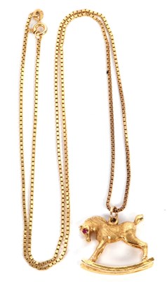 Lot 143 - A 9ct rocking horse pendant and chain, the 9ct...