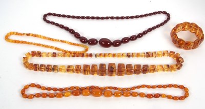 Lot 227 - A quantity of amber and faux amber, to include...