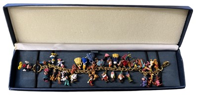 Lot 199 - A boxed 24ct gold plated Disney charm bracelet...