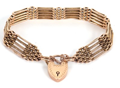 Lot 181 - A gate bracelet, with satin and textured links,...