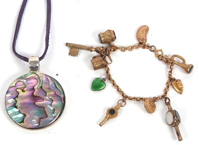 Lot 208 - A charm bracelet, with one link stamped 9c,...