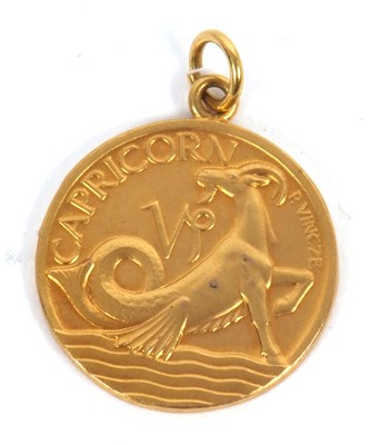 Lot 169 - A 9ct Capricorn pendant, the front with relief...