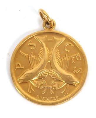 Lot 171 - A 9ct Pisces pendant, the front with relief...