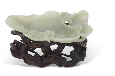 Lot 124 - Green jade dish on carved wooden stand, 15cm long