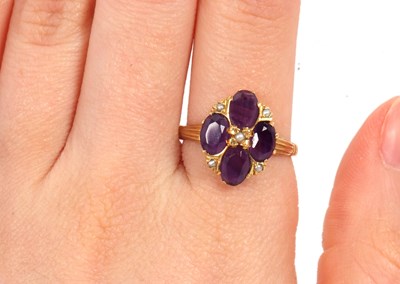 Lot 28 - An 18ct amethyst and seed pearl ring, the four...