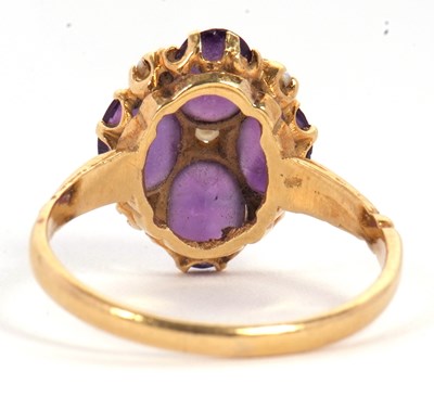 Lot 28 - An 18ct amethyst and seed pearl ring, the four...