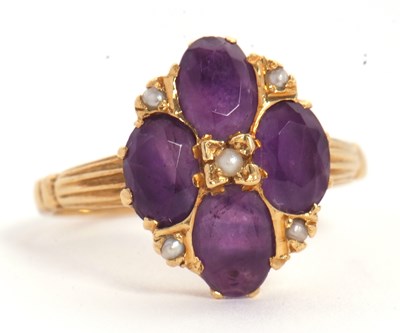 Lot 28 - An 18ct amethyst and seed pearl ring, the four...