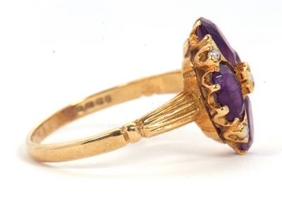 Lot 28 - An 18ct amethyst and seed pearl ring, the four...