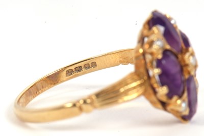 Lot 28 - An 18ct amethyst and seed pearl ring, the four...
