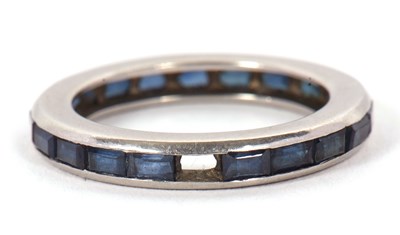 Lot 24 - A sapphire eternity ring, channel set with...