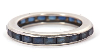Lot 24 - A sapphire eternity ring, channel set with...