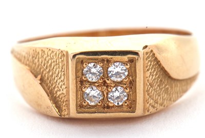 Lot 6 - A gentleman's dress ring, the central squared...