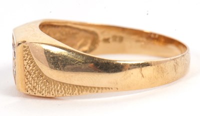 Lot 6 - A gentleman's dress ring, the central squared...