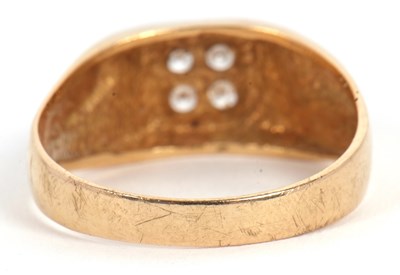 Lot 6 - A gentleman's dress ring, the central squared...