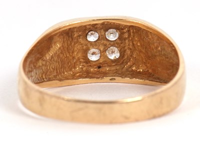 Lot 6 - A gentleman's dress ring, the central squared...