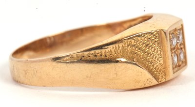 Lot 6 - A gentleman's dress ring, the central squared...