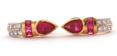 Lot 107 - A pair of 18ct earrings: the Eastern styled...