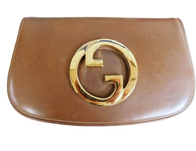 Lot 88 - A c.1960's Gucci clutch bag, the brown...
