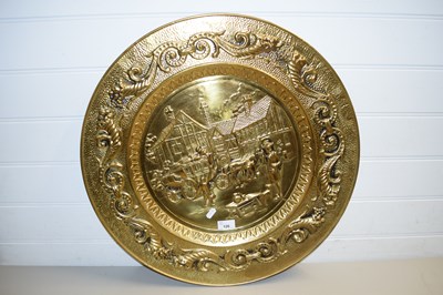 Lot 126 - LARGE PRESSED BRASS WALL CHARGER