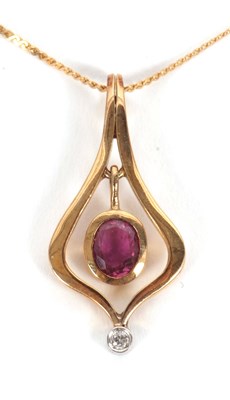 Lot 106 - A ruby and diamond pendant and chain, the...