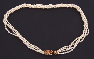 Lot 118 - A cultured pearl necklace with dragon clasp;...