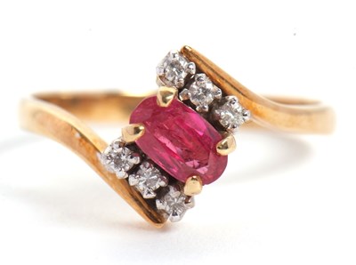 Lot 38 - A ruby and diamond ring, the oval ruby set...