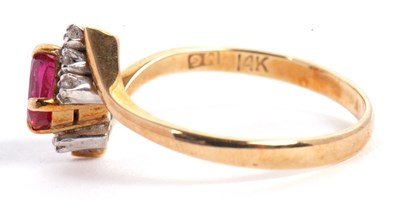 Lot 38 - A ruby and diamond ring, the oval ruby set...