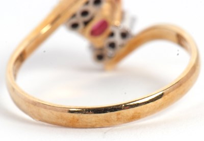 Lot 38 - A ruby and diamond ring, the oval ruby set...