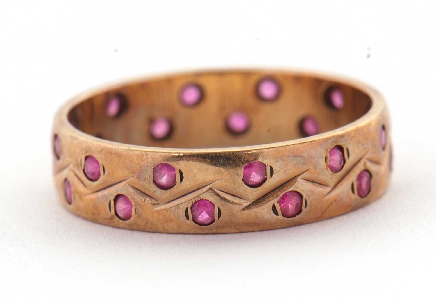 Lot 34 - A 9ct ruby ring, the 4mm wide band set with...
