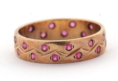 Lot 34 - A 9ct ruby ring, the 4mm wide band set with...