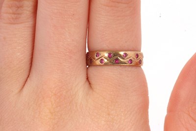 Lot 34 - A 9ct ruby ring, the 4mm wide band set with...