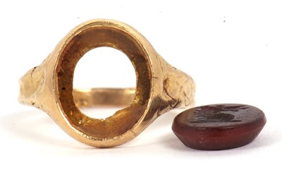 Lot 16 - A hardstone signet ring, set with a carnelian...