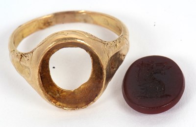 Lot 16 - A hardstone signet ring, set with a carnelian...