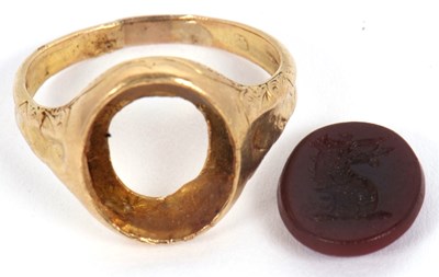 Lot 16 - A hardstone signet ring, set with a carnelian...